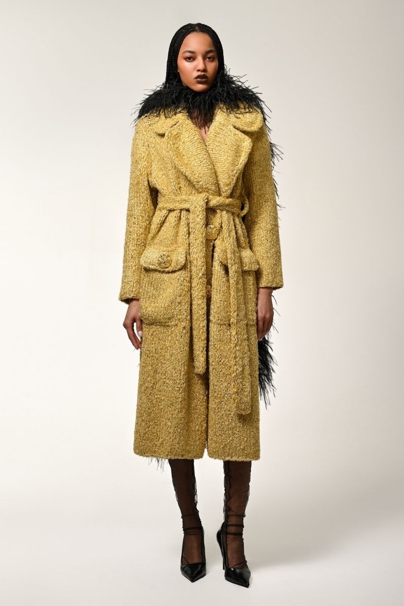 Lalo oversized coat with belt in gold, showing a textured fabric, wide lapels, and a stylish relaxed fit.
