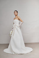 White Plan LEEJEI maxi dress with flowy fabric and sleeveless design, perfect for casual summer wear.