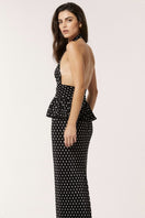 Señorita Sofia black maxi dress shown on a model, flowing fabric, sleeveless design, perfect for elegant summer occasions.