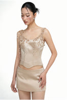 21Six Delilah silk taffeta co-ords featuring a beige top and Marielle skirt, styled together in a coordinated fashion.