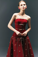 HAPPY CLOTHING CULT MIA X strapless stone organza gown with a flowing, textured design and elegant silhouette.