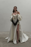 Off-White Volume Sculpted Gown by Monetre, features a flowing silhouette with sculpted design and elegant fabric.