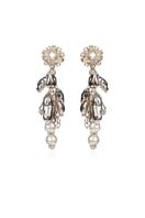 Aidan & Ice Neilla silver earrings featuring sleek, modern design with polished silver finish, displayed on a white background.