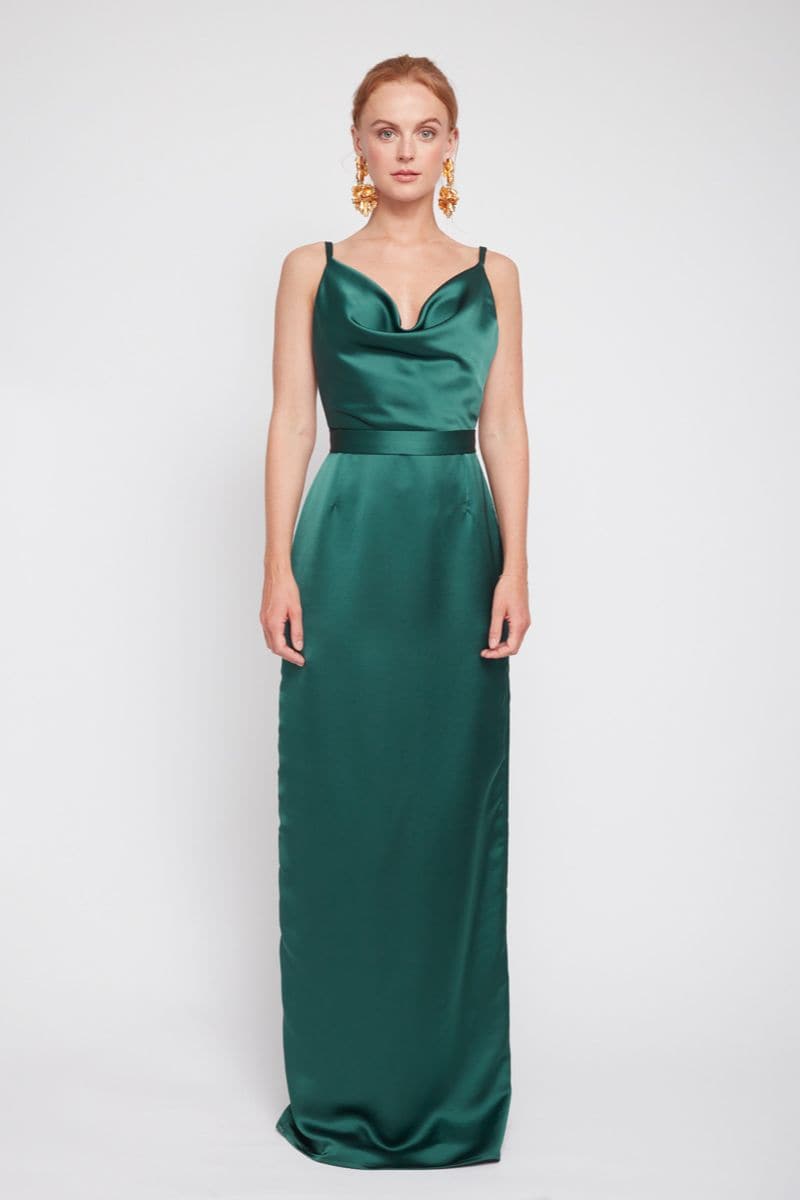 Undress Amila Deep Green Backless Maxi Dress displayed on a model, featuring a flowing silhouette and backless design.
