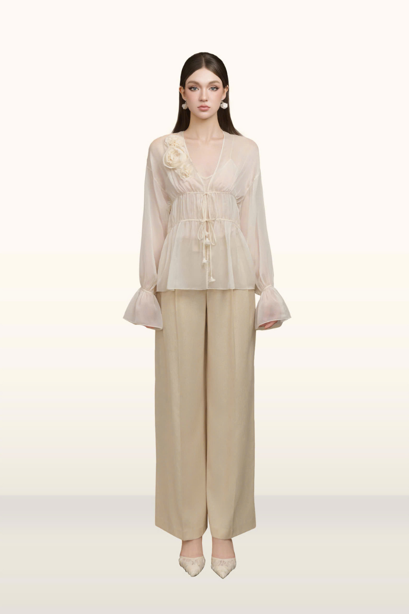 Arti Apparel Serin Top featuring a stylish, fitted design with a high neckline and elegant detailing.
