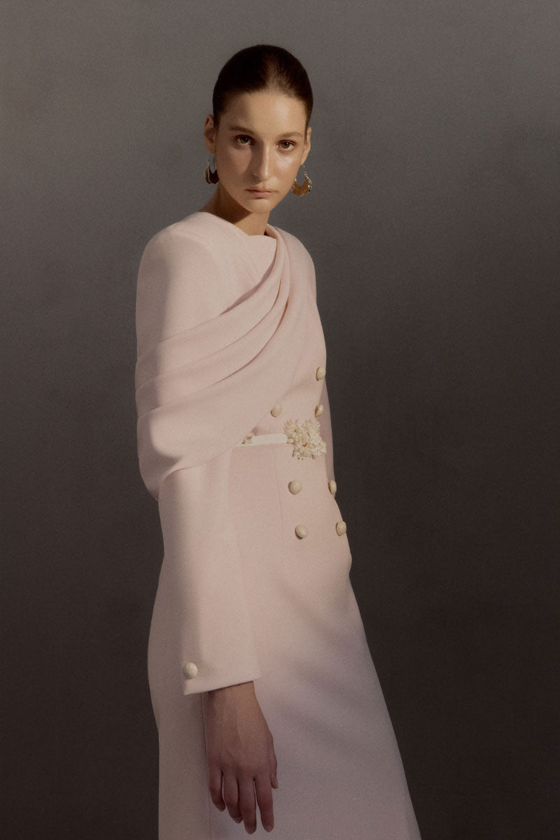 White Plan Miranda gown displayed on a hanger, featuring elegant fabric and detailed design for formal occasions.