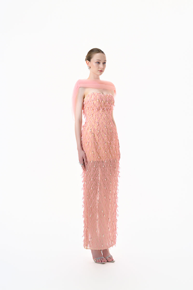 Peach beaded sheer overlay gown by Happy Clothing featuring delicate beadwork and flowing fabric for elegant evening wear.
