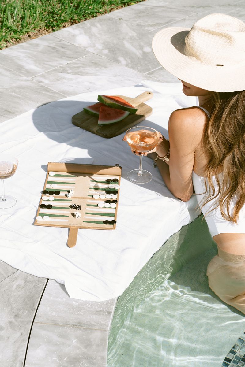 Travel Backgammon Board in Tulum by Throwing Doubles, featuring vibrant design and portable game setup on a wooden surface.