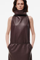 Brown maxi dress with high collar by Kris Marán, featuring a flowing design and elegant neckline.