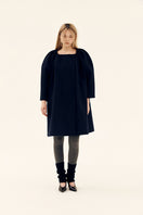Chictopia midnight cocoon coat in navy, stylish and cozy outerwear with a relaxed fit, displayed on a hanger.