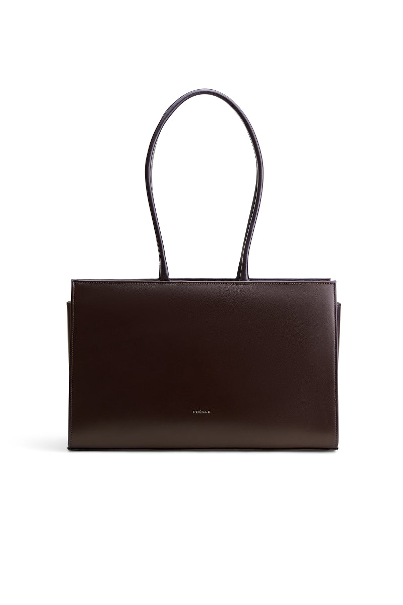 Poelle Carolyn tote bag in medium-sized brown suede, stylish shoulder bag with sleek design and soft texture.
