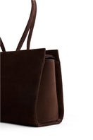 Dark brown POELLE Carolyn tote bag in medium leather with shoulder strap, featuring a sleek design and spacious interior.