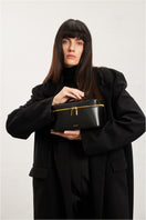 Large black POELLE LILIBET top handle bag with sleek design and sturdy handles, perfect for everyday use.