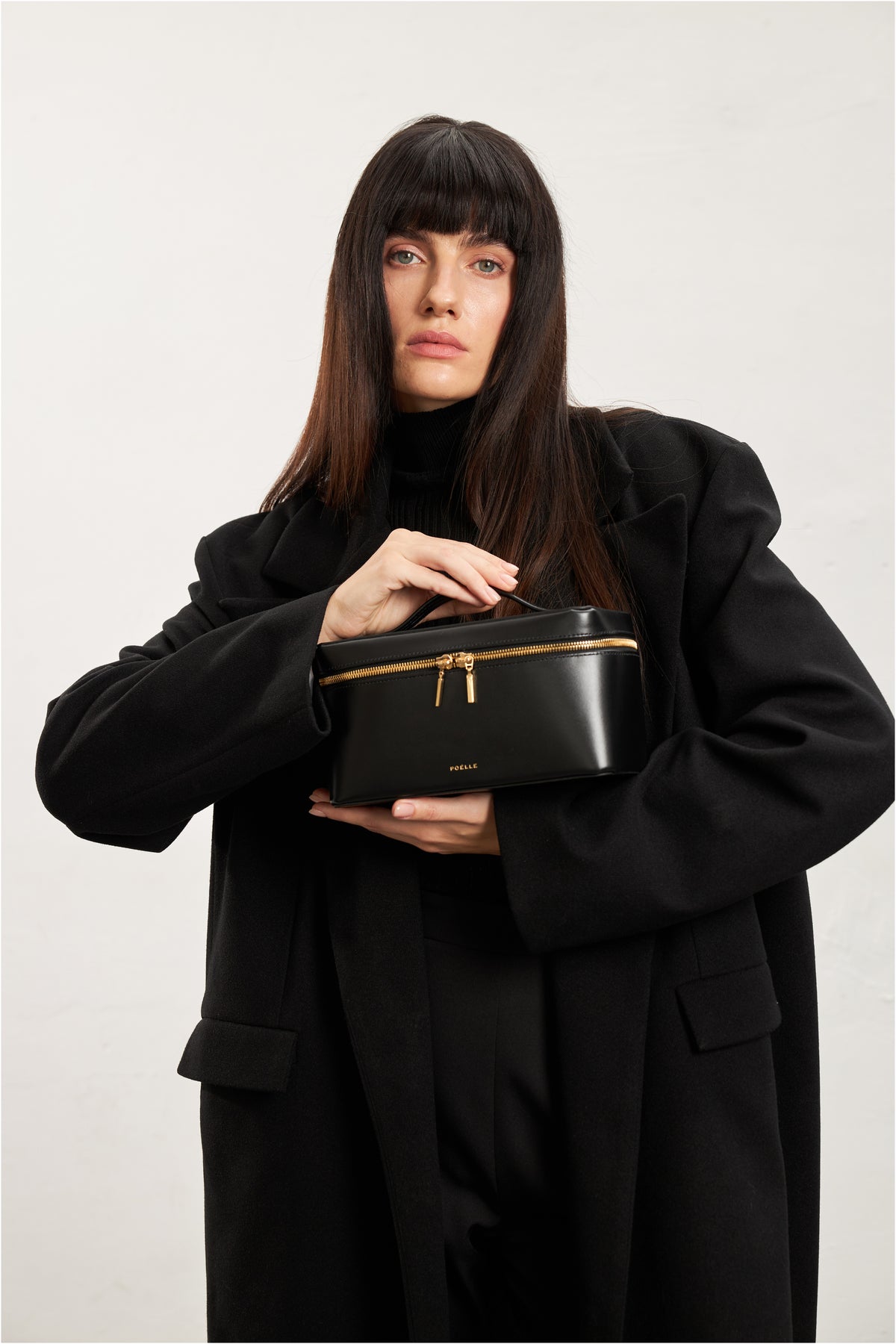 Large black POELLE LILIBET top handle bag with sleek design and sturdy handles, perfect for everyday use.