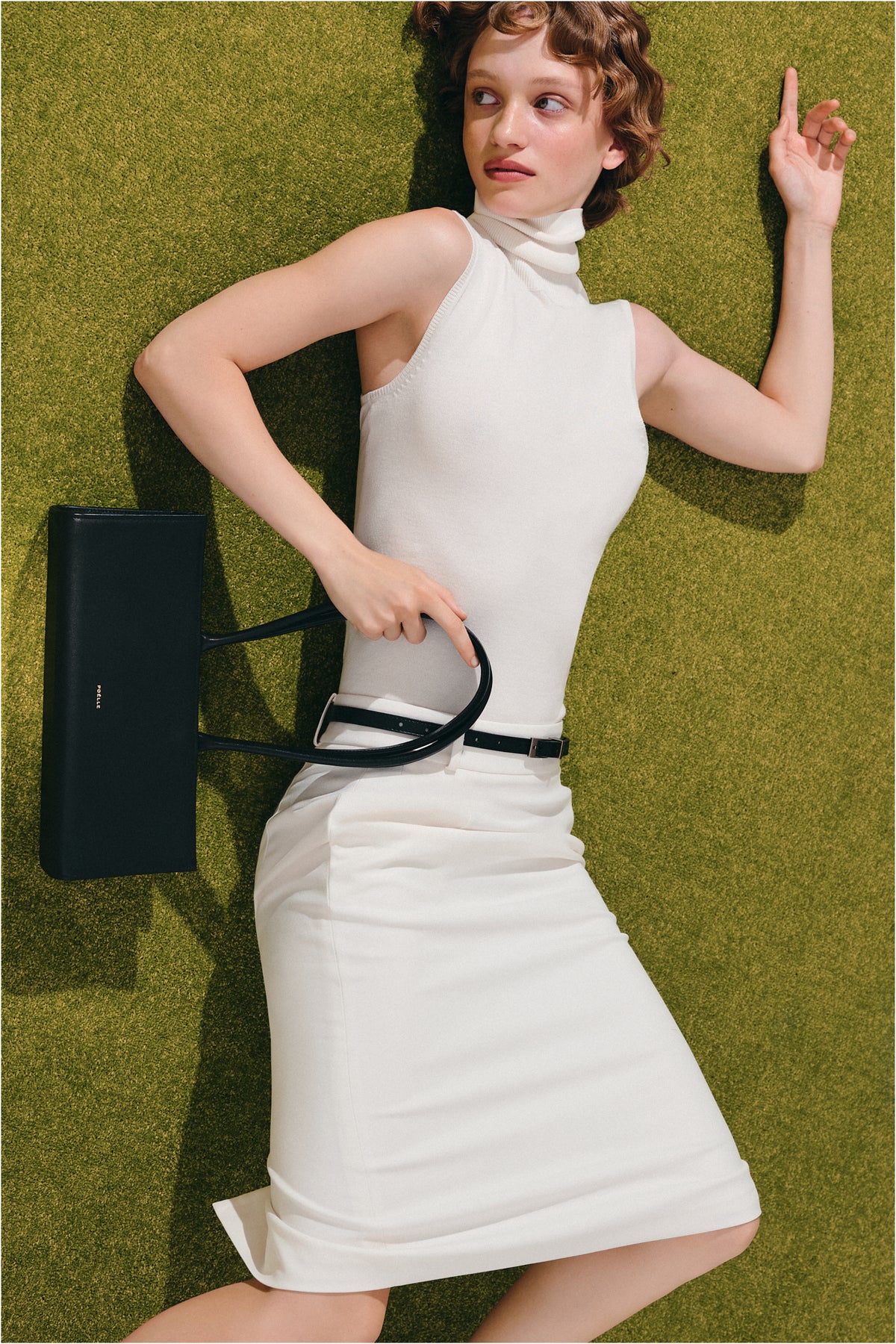 Black POELLE CECILIE top handle bag with sleek design and sturdy handles, perfect for stylish everyday use.