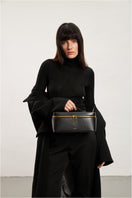 Large black POELLE LILIBET top handle bag with sleek design and sturdy handles, perfect for stylish everyday use.