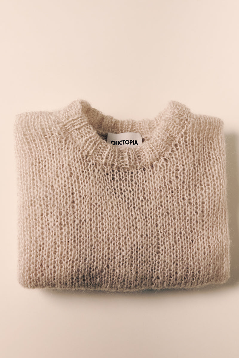 Light gray hand-knitted sweater by Chictopia, featuring a cozy, textured knit pattern perfect for casual wear.