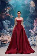 Red SIENNA ROYAL TAFFETA gown by 21Six featuring elegant flowing fabric and a sophisticated design.