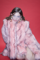 Sudi Etuz faux fur jacket with attached scarf, cozy coat featuring plush fur and stylish design, perfect for cold weather.