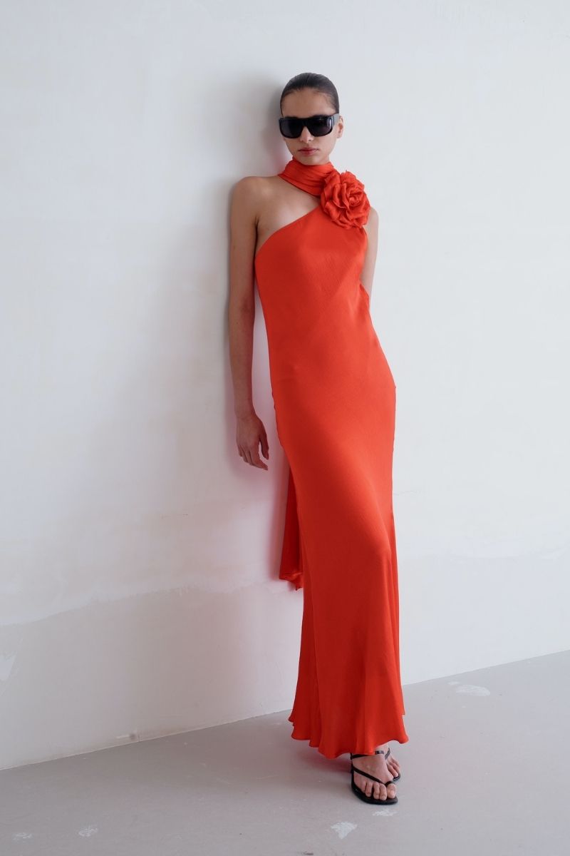 Sisters Marilyn maxi dress in vibrant scarlet red with flowing fabric and elegant design, perfect for formal occasions.