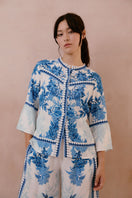 Raishma Myra Shirt shown in a stylish, casual design with a button-up front and long sleeves, displayed on a neutral background.