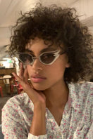 Silver Wild at Heart sunglasses by Moy Atelier with bold frames and dark tinted lenses, stylish and eye-catching.