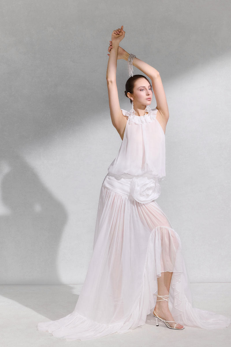 Arti Apparel SALUS maxi dress in flowy fabric with a relaxed fit, featuring a stylish neckline and vibrant floral pattern.