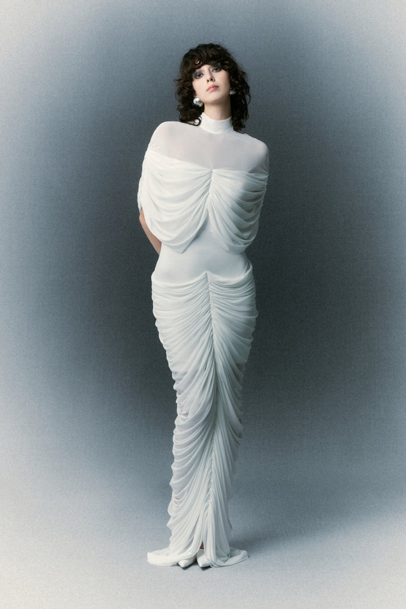 Elegant White Plan Brilliant dress gown with intricate detailing, flowing fabric, and a sophisticated design for formal occasions.