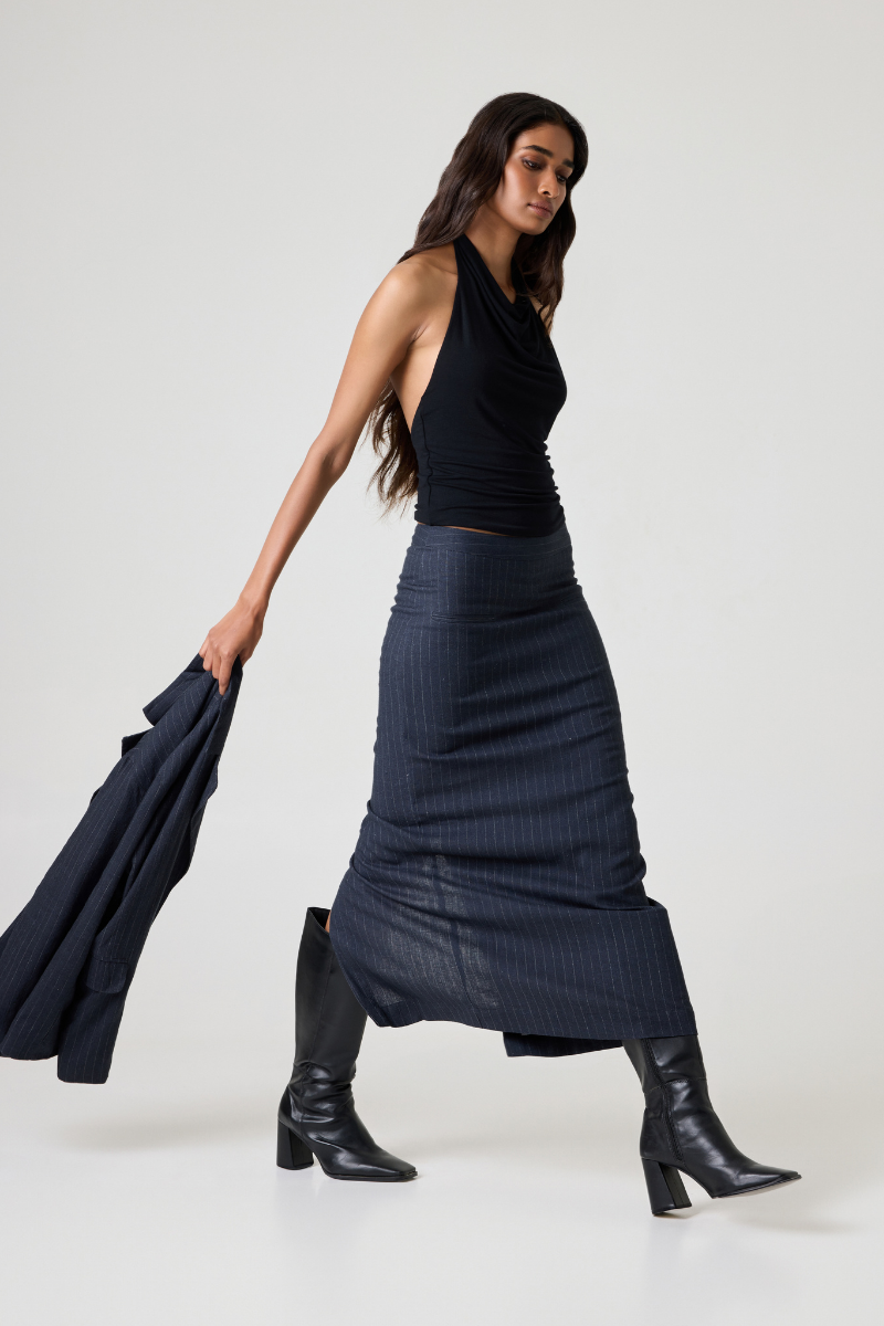 Summer Away Audrey midi skirt in vintage blue fabric, featuring a flowy design and midi length, displayed on a hanger.