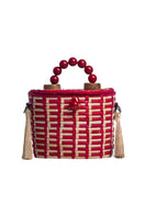Red Catarina Mina Jirau top handle basket bag with sturdy handles and spacious interior.