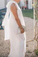 Adriana Castro La Barca Mini Leather Clutch in silver with sleek design and compact size.