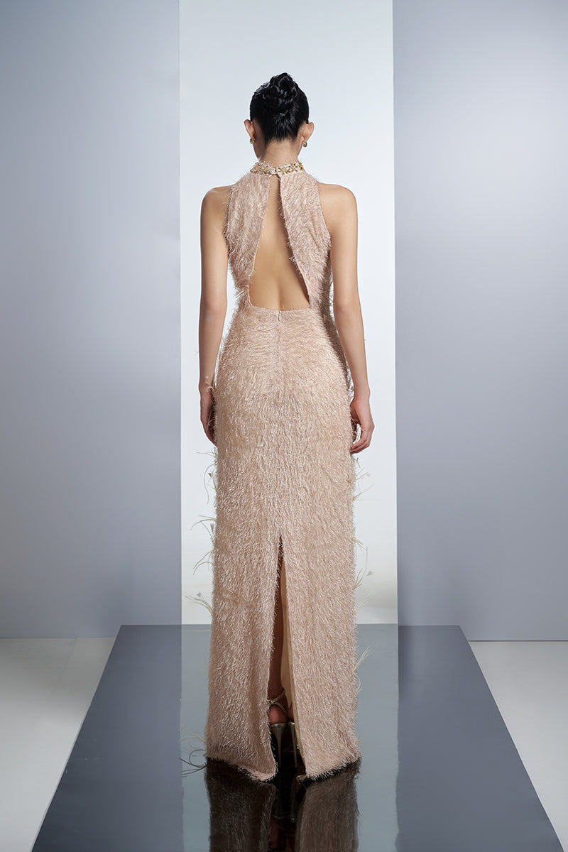 Beige feather gown by Happy Clothing featuring flowing fabric and elegant design, ideal for formal occasions.