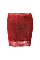 Natalia Fedner red chain mini skirt with slip, featuring a fitted design and chain detailing, worn on a model.