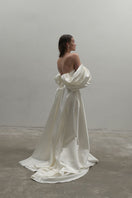Off-White Volume Sculpted Gown by Monetre featuring a flowing, sculptural design in elegant fabric.