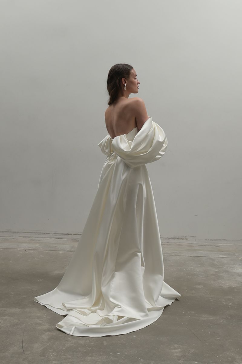Off-White Volume Sculpted Gown by Monetre featuring a flowing, sculptural design in elegant fabric.
