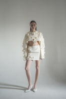 Blikvanger Milky Floral Bolero jacket featuring a delicate floral pattern and lightweight fabric, perfect for layering.