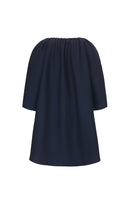 Navy midnight cocoon coat by Chictopia hanging on a clothing rack, showcasing its oversized, cozy silhouette and smooth fabric.