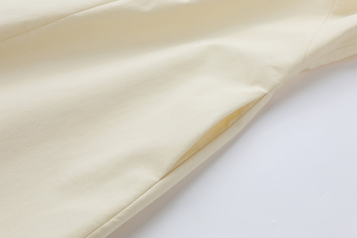 Cream cotton mini dress by Chictopia, featuring a stylish fit and simple design, shown on a model.