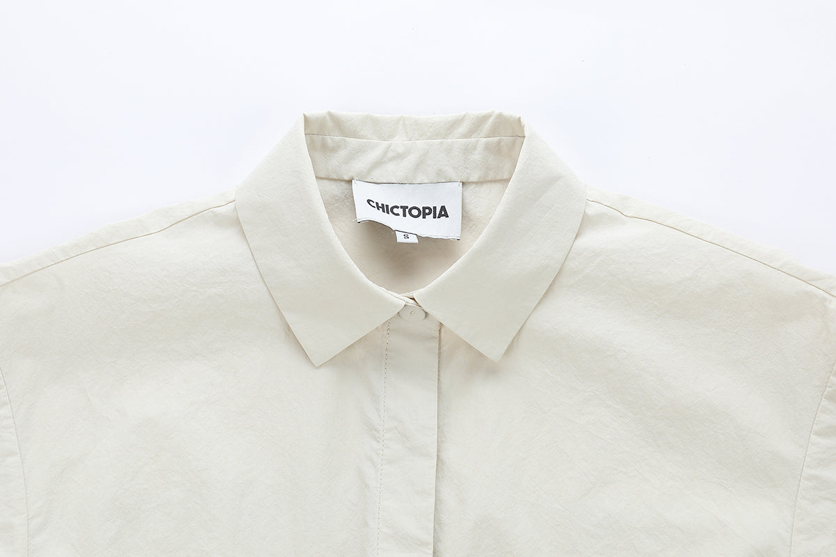 Chictopia stone-colored poplin shirt dress, mini length with button-front and collar, casual and stylish for everyday wear.
