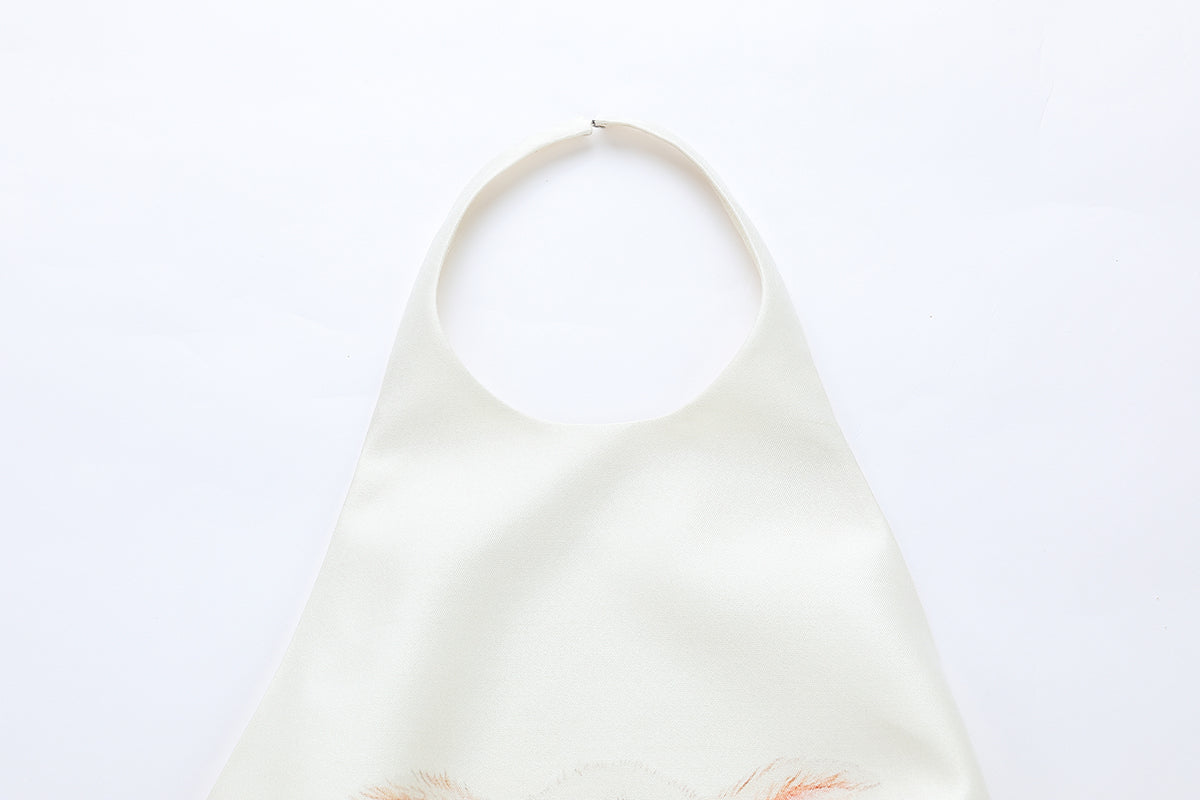 Ivory silk wool mini dress by Chictopia with a fitted silhouette and elegant neckline, displayed on a hanger.