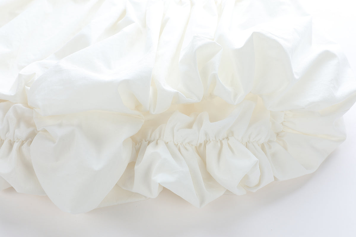 Chictopia ivory poplin shorts with a relaxed fit and side pockets, perfect for casual summer wear.