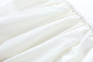 Chictopia ivory poplin shorts with a relaxed fit, featuring a high waist and side pockets, perfect for casual summer wear.