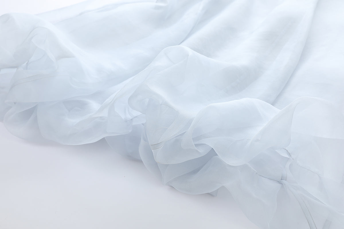 Chictopia smoke-colored organza midi dress with flowing fabric and elegant design, perfect for formal occasions.