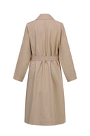 Beige cotton trench coat by Chictopia with classic collar and belted waist, stylish outerwear for women.