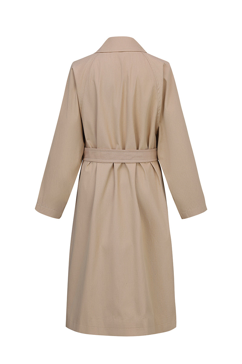 Beige cotton trench coat by Chictopia with classic collar and belted waist, stylish outerwear for women.