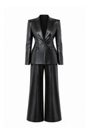 Lili Blanc vegan core trousers, stylish pants in a relaxed fit with a clean, modern design, shown on a model.