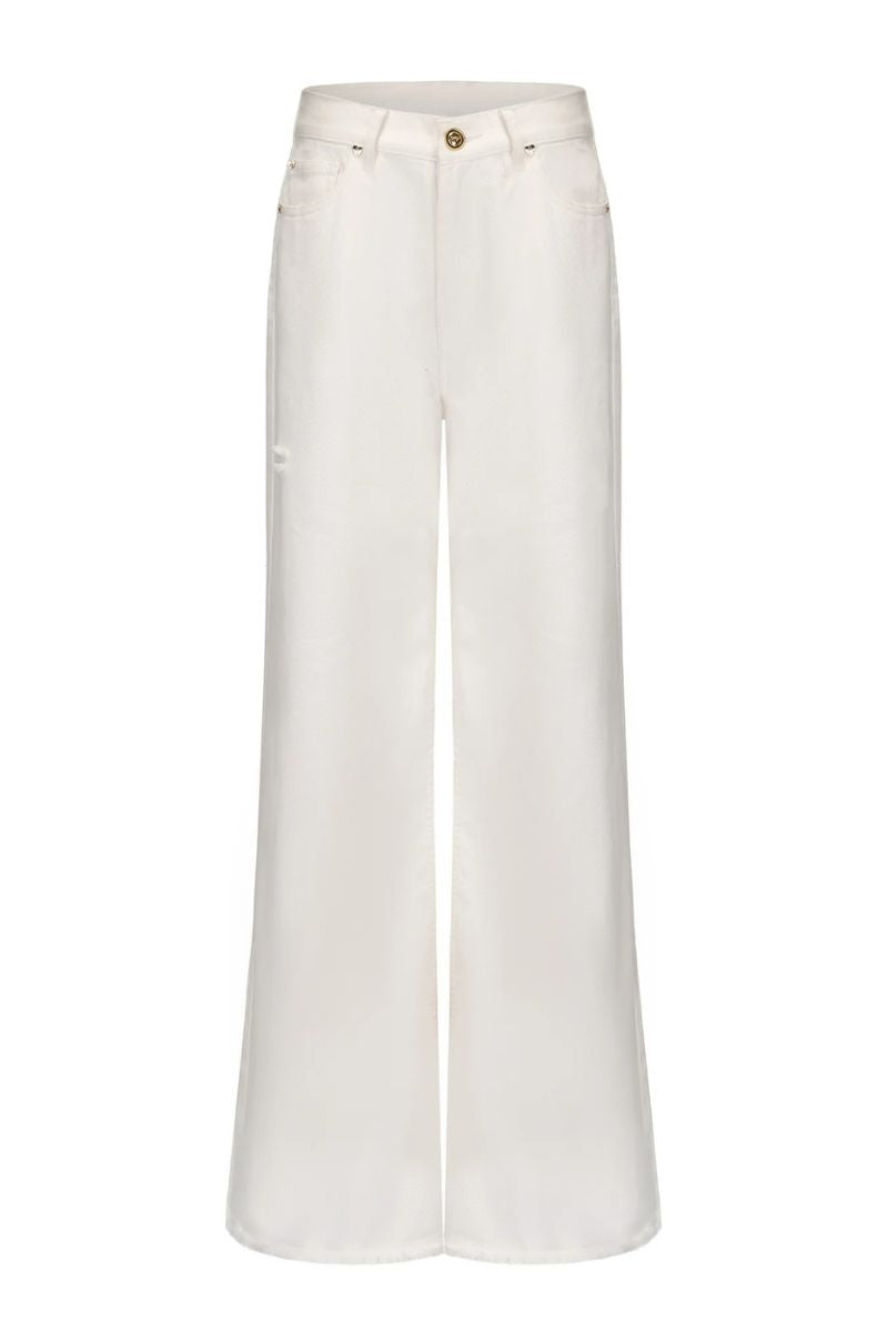 White Colette jeans by Nana Jacqueline featuring a slim fit and classic denim style, shown on a model.