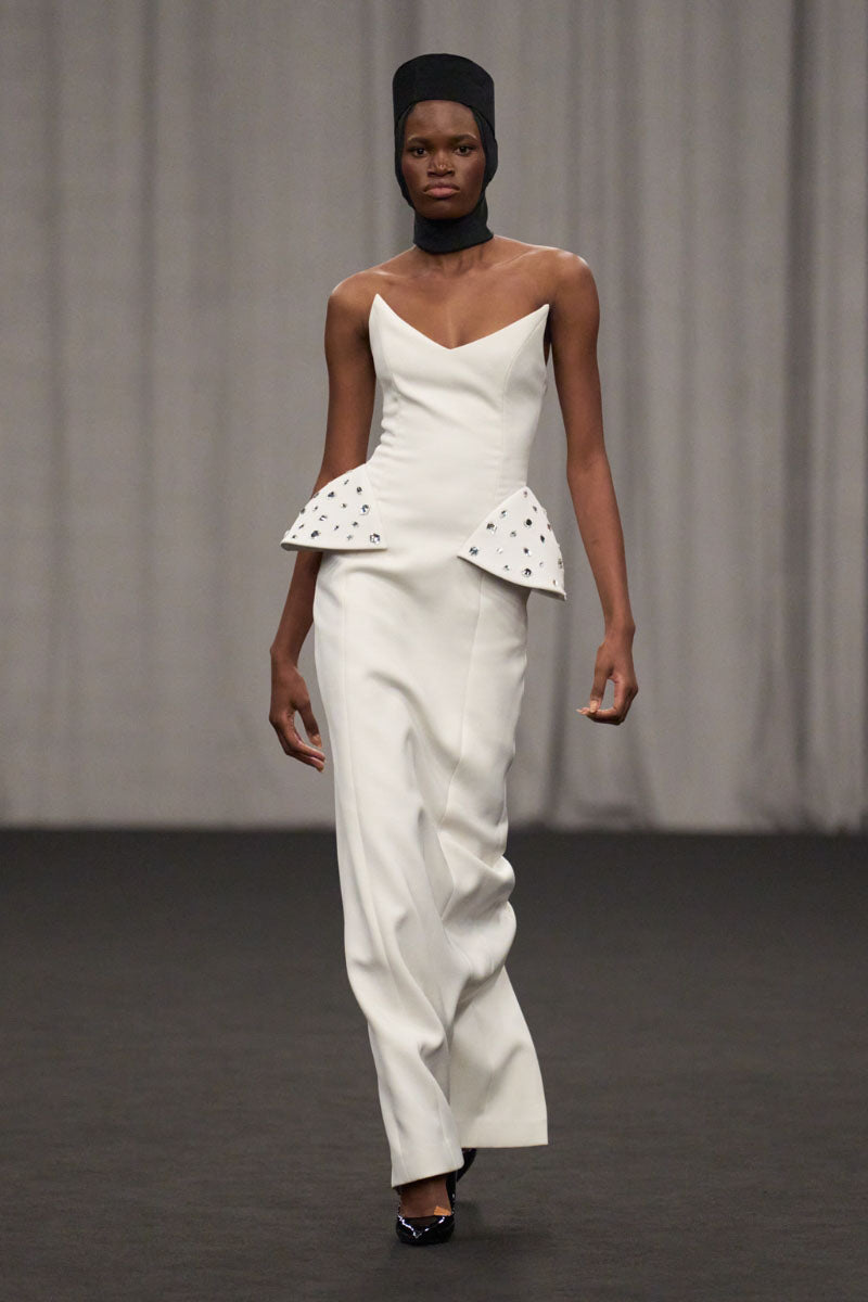 Lili Blanc strapless structured gown with a fitted bodice and flowing skirt, elegant formal evening dress.