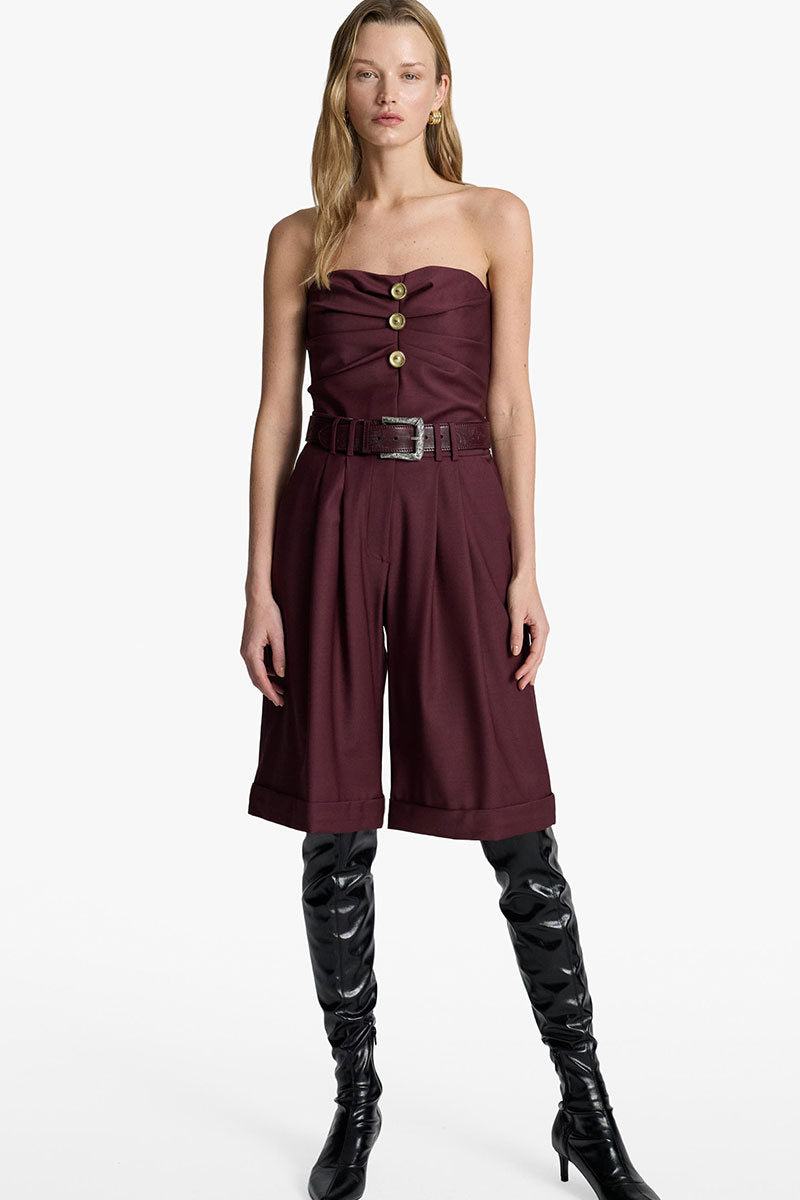 Acaria Studio Guru Shorts in deep red wine color, casual shorts with a comfortable fit, shown on a hanger.