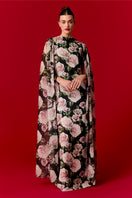 Nur Karaata Marianne maxi dress, flowing fabric and elegant design, displayed on a hanger against a neutral background.